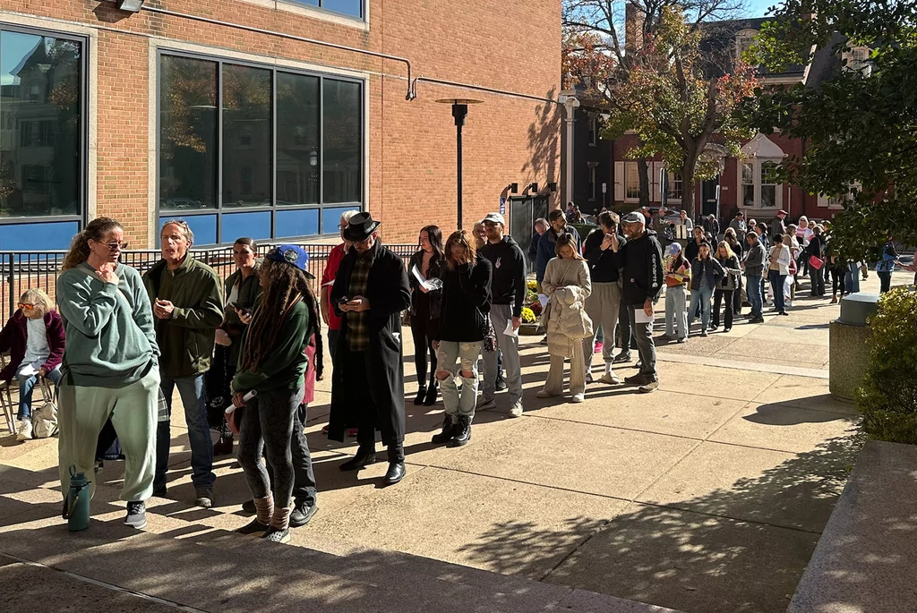 People wait in line outside the Bucks County government building to apply for an on-demand mail ballot on the last day to request one in Doylestown, Pa., Tuesday, Oct. 29, 2024. (AP Photo/Mike Catalini)