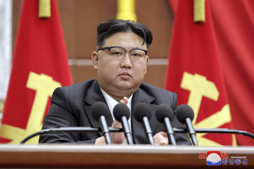 In this photo provided by the North Korean government, North Korean leader Kim Jong Un delivers a speech during a year-end plenary meeting of the ruling Workersâ Party, which was held between Tuesday, Dec. 26, and Saturday, Dec. 30, 2023, in Pyongyang, North Korea. Independent journalists were not given access to cover the event depicted in this image distributed by the North Korean government. The content of this image is as provided and cannot be independently verified. The Korean language watermark on the image as provided by the source reads "KCNA" which is the abbreviation for Korean Central News Agency.