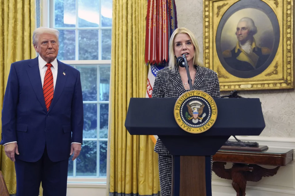 Attorney General Pam Bondi speaks after being sworn in by Supreme Court Associate Justice Clarence Thomas, in the Oval Office of the White House, Wednesday, Feb. 5, 2025, in Washington, as President Donald Trump looks on. (AP Photo/Evan Vucci)