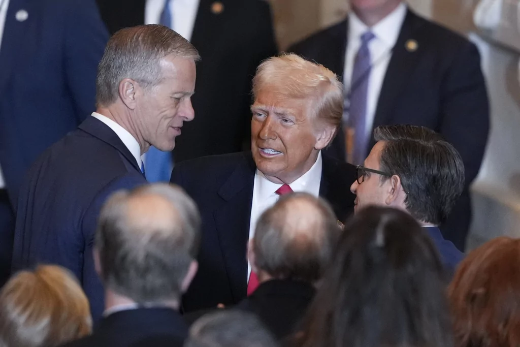 President Donald Trump talks to Senate Majority Leader John Thune, R-S.D., left and and House Speaker Mike Johnson, R-La., right, after he spoke to the National Prayer Breakfast, at the Capitol in Washington, Thursday, Feb. 6, 2025.