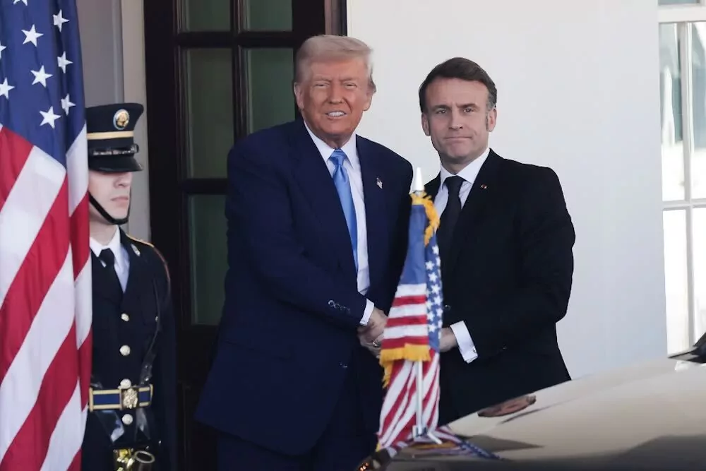 President Trump greets French President Emmanuel Macron at the White House on Feb. 24, 2025. (Graeme Jennings/Washington Examiner)