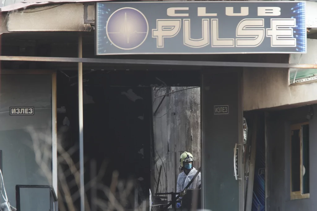 A firefighter inspects a nightclub after a massive fire in the town of Kocani, North Macedonia, Sunday, March 16, 2025.