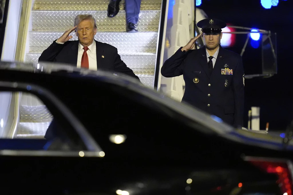 President Donald Trump arrives on Air Force One at Palm Beach International Airport, Friday, March 14, 2025, in West Palm Beach, Fla.