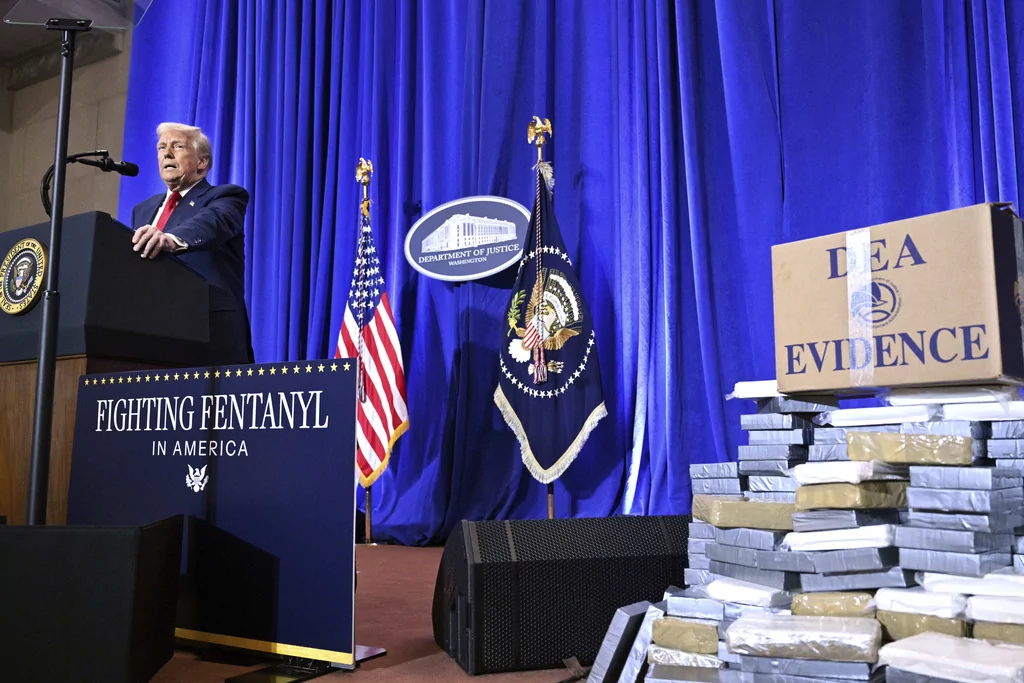 President Donald Trump speaks at the Justice Department in Washington, Friday, March 14, 2025. (Pool via AP)