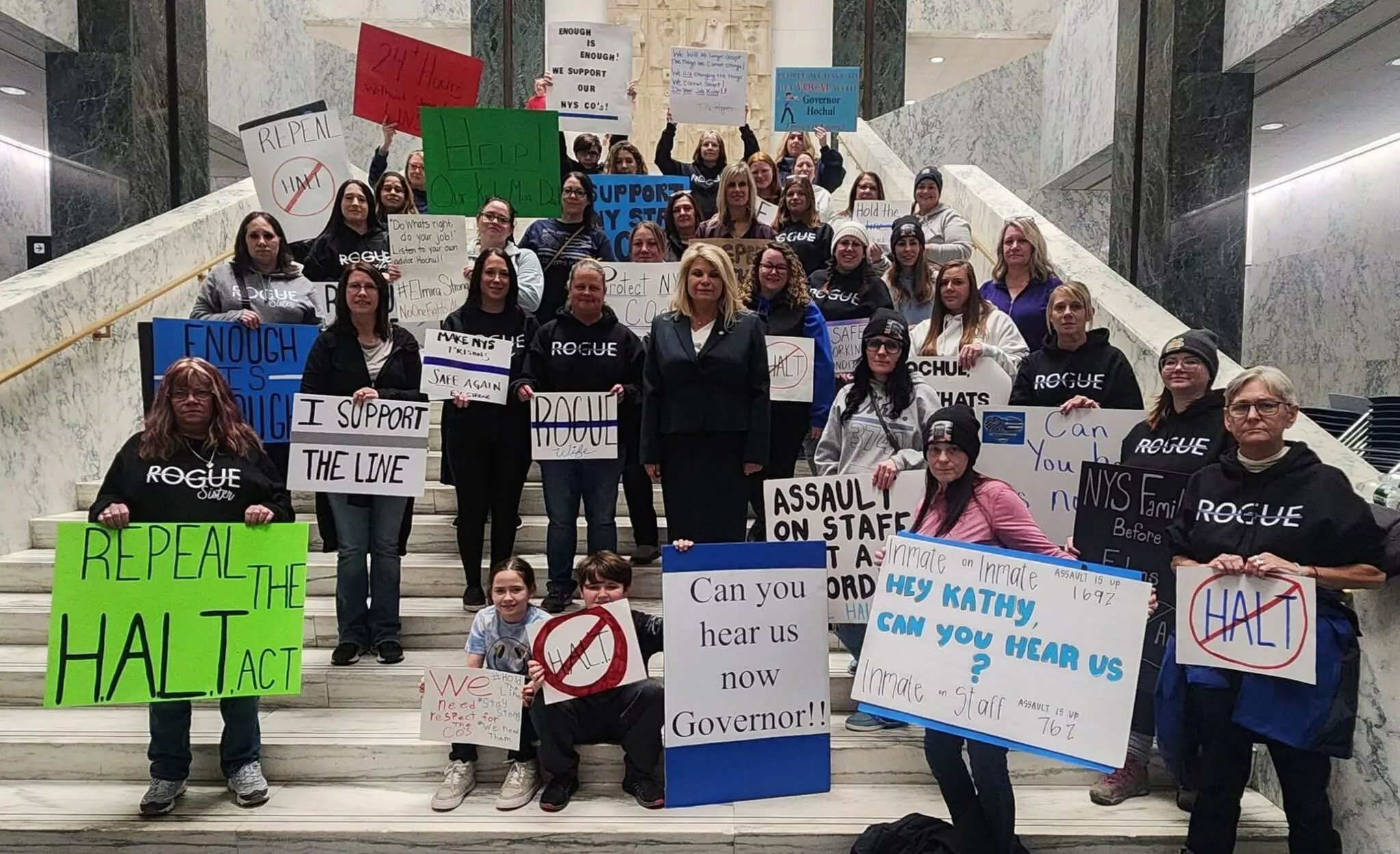 Families of striking correctional officers gather outside the Capitol building in Albany, New York.