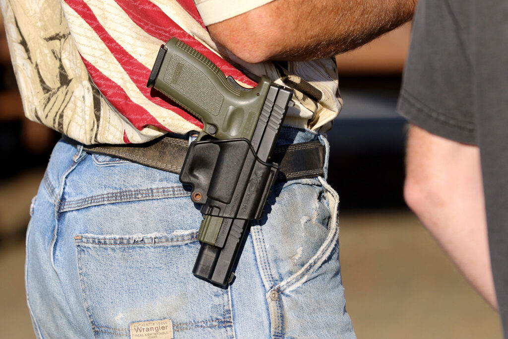 House Democrats say it should be illegal for people to carry handguns into airports, even though they admit that law could leave people unprotected from "attacks by armed gunmen" that are happening increasingly in airports. (AP Photo/Ryan Kang, File)