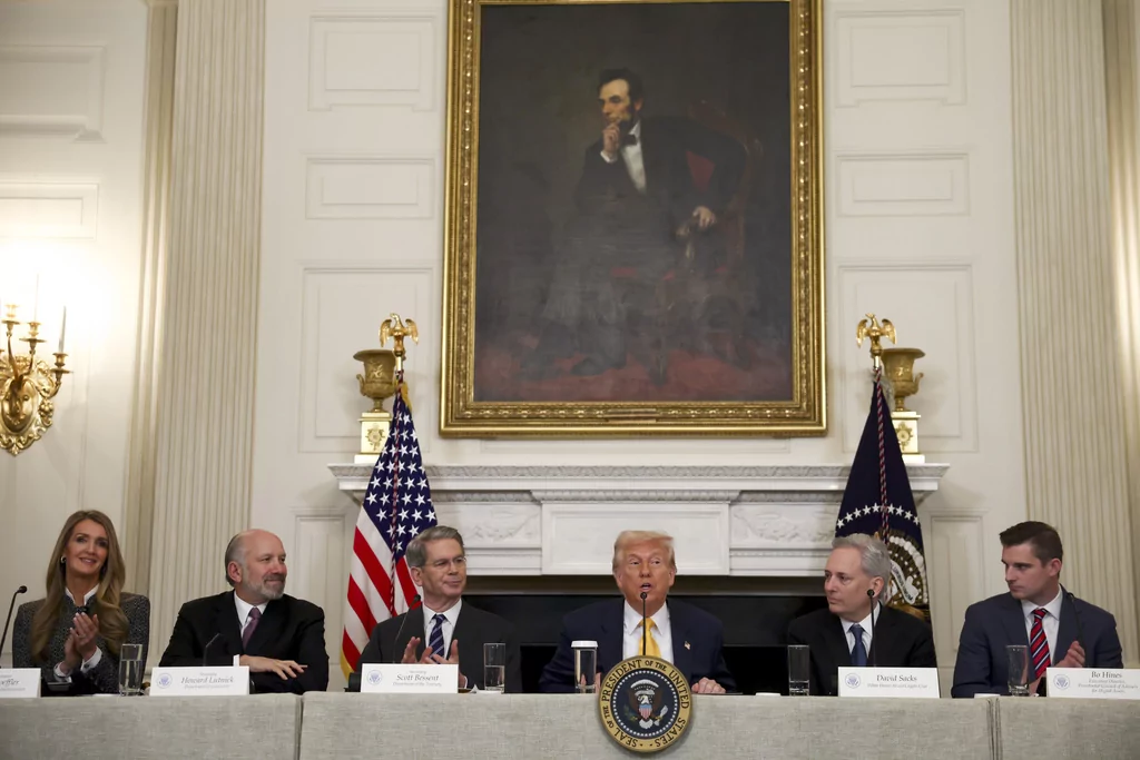 President Donald Trump speaks as administrator Kelly Loeffler, of the Small Business Administration, from left, Secretary of Commerce Howard Lutnick, Treasury Secretary Scott Bessent, White House AI and crypto czar David Sacks and Bo Hines, a member of the presidential council of advisers for digital assets, listen at the White House Crypto Summit in Washington, Friday, March 7, 2025. 