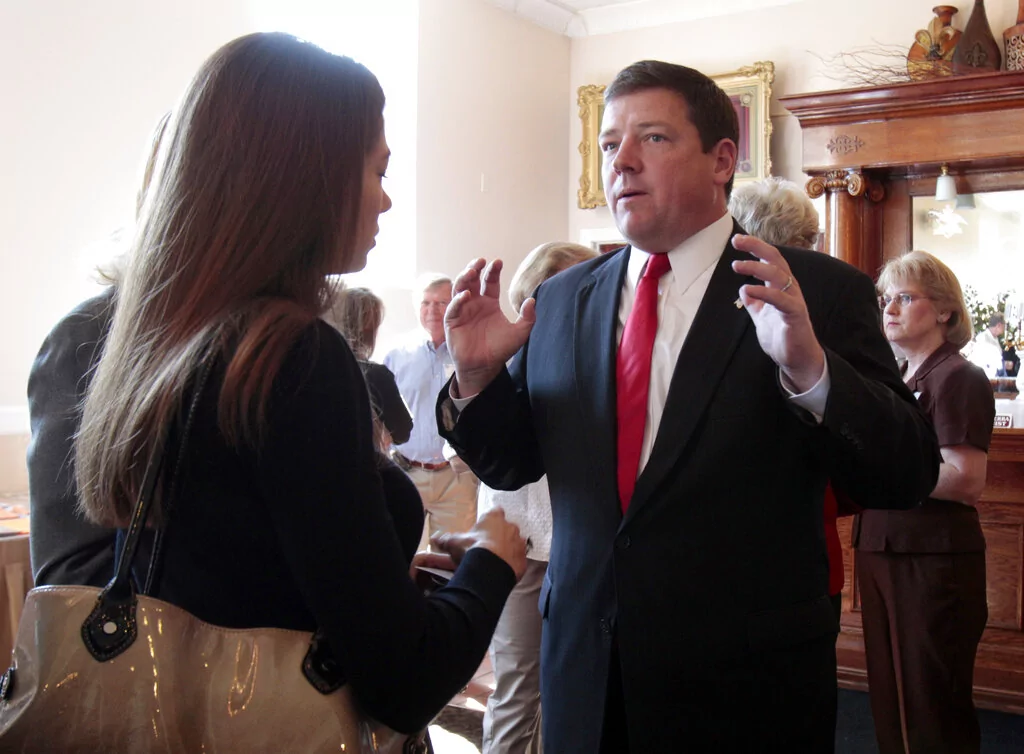 In this photo made Wednesday, Oct. 6, 2010, Ed Martin, Republican candidate for U.S. Congress in Missouri's 3rd District, talks with prospective voters at a candidate forum in Fenton, Mo. Martin is running against incumbent, Democrat Russ Carnahan;