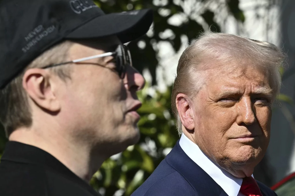 President Donald Trump and Tesla CEO Elon Musk talk with to reporters near Tesla vehicles on the South Lawn of the White House Tuesday, March 11, 2025, in Washington.