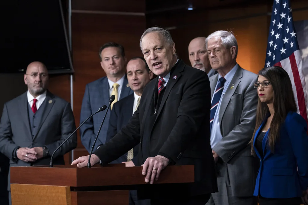 Rep. Andy Biggs, R-Ariz., center, speaks as members of the House Freedom Caucus hold a news conference at the Capitol in Washington, on March 10, 2023. From left are Rep. Clay Higgins, R-La., Rep. Michael Cloud, R-Fla., Rep. Bob Good, R-Va., Rep. Andy Biggs, R-Ariz., Rep. Chip Roy, R-Texas, Rep. Ralph Norman, R-S.C., and Rep. Lauren Boebert, R-Colo. (AP Photo/J. Scott Applewhite, File)