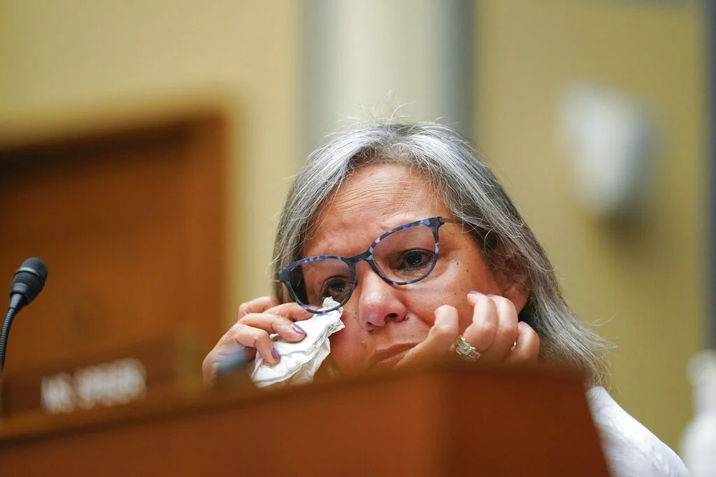 Rep. Robin Kelly, D-Ill., wipes tears from her eye as she listens to testimony during a House Committee on Oversight and Reform hearing on gun violence on Capitol Hill in Washington, Wednesday, June 8, 2022.