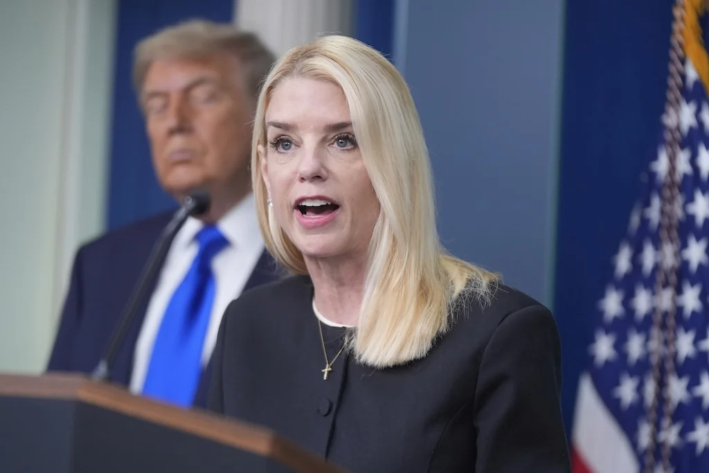 Attorney General Pam Bondi speaks to the media, Friday, June 27, 2025, in the briefing room of the White House in Washington, as President Trump looks on. (AP Photo/Manuel Ceneta)