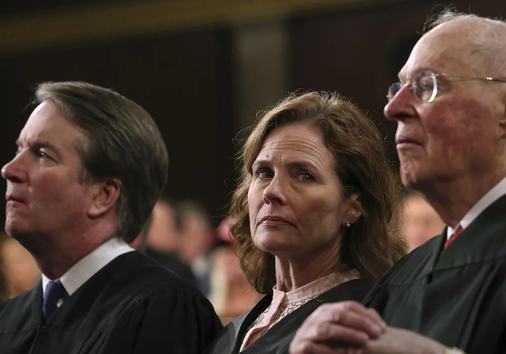 From left, Justice Brett Kavanaugh, Justice Amy Coney Barrett and retired Justice Anthony Kennedy listen as President Donald Trump addresses a joint session of Congress at the Capitol in Washington, Tuesday, March 4, 2025. (Win McNamee/Pool Photo via AP)