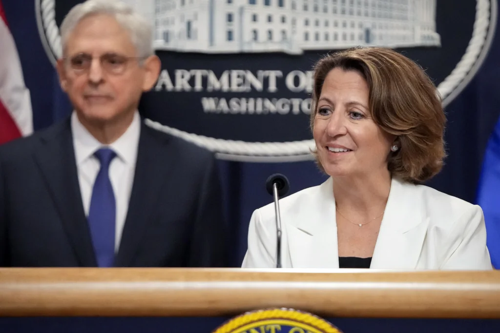 Deputy Attorney General Lisa Monaco speaks with reporters about an antitrust lawsuit against real estate software company RealPage during a news conference at the Department of Justice, Friday, Aug. 23, 2024, in Washington. At left is Attorney General Merrick Garland. (AP Photo/Mark Schiefelbein)