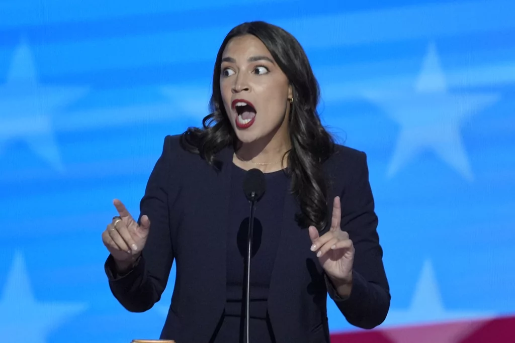 Rep. Alexandria Ocasio-Cortez, D-NY, speaking during the Democratic National Convention on Monday, Aug. 19, 2024, in Chicago. (AP Photo/J. Scott Applewhite)