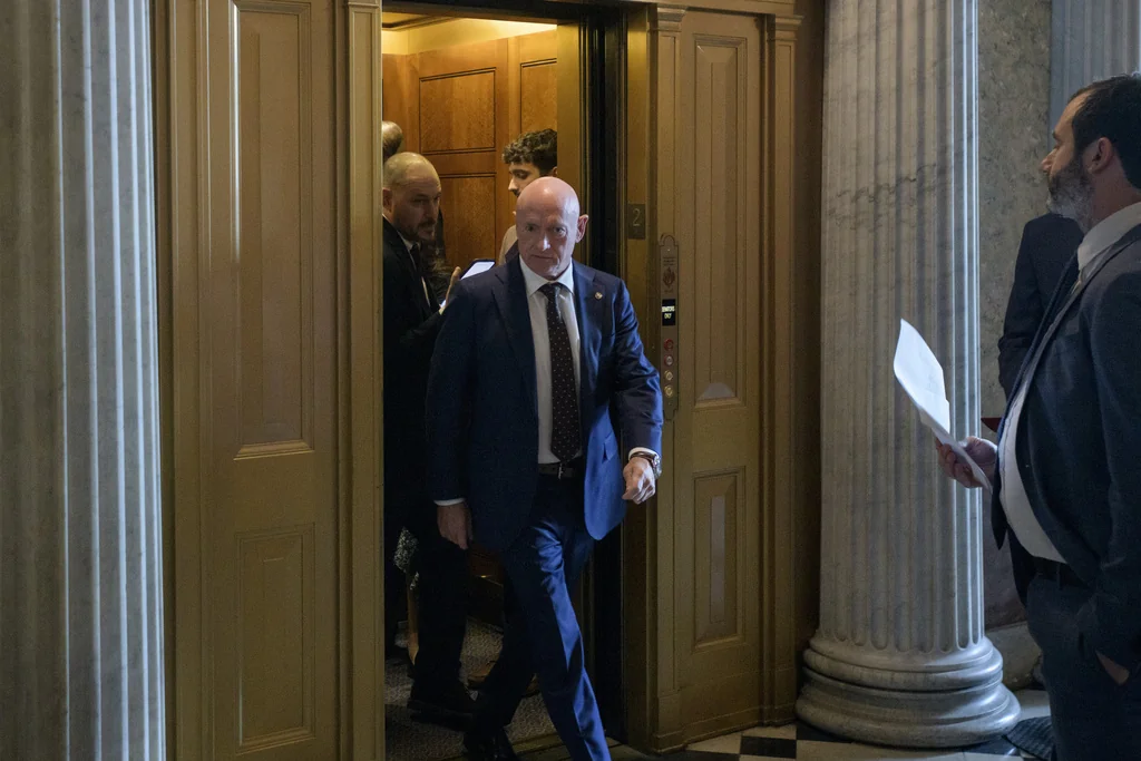 Sen. Mark Kelly, D-Ariz., walks to the Senate chamber as Senate Republicans vote on President Donald Trump's request to cancel about $9 billion in foreign aid and public broadcasting spending, at the Capitol in Washington, Wednesday, July 16, 2025.