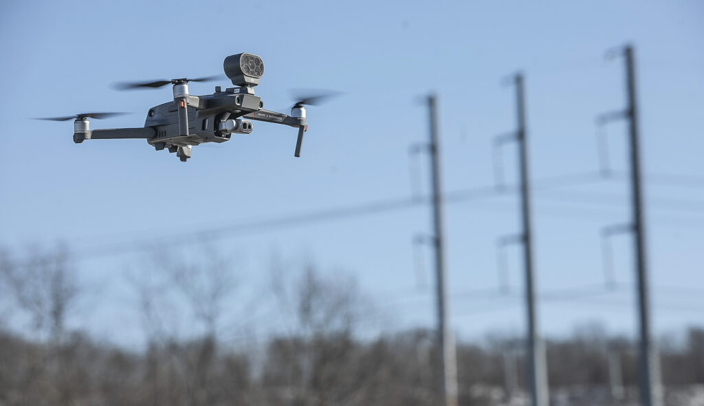 A DJI Mavic Pro 2 Enterprise with attached speaker for emergencies hovers while controlled by members of the Meriden police and fire departments at the William Dunn Sport Complex on Thorpe Avenue in Meriden, Wed., Jan. 22, 2020.