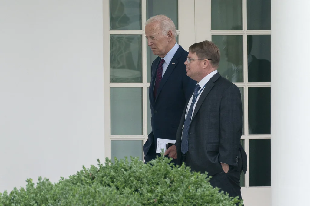 President Joe Biden walks along the Colonnade at the White House with his physician Kevin O'Connor, Aug. 28, 2023. O'Connor, known to President Joe Biden and others around the White House simply as "doc", has been a part of the president's life for more than a decade and was a central figure to the family when Biden's son Beau was dying of cancer.