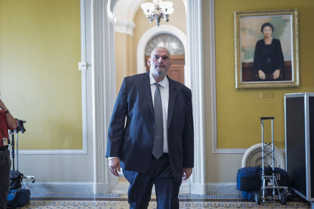 Sen. John Fetterman, D-Pa., arrives at the chamber as senators gather for an official group photo, at the Capitol in Washington, Tuesday, July 15, 2025.
