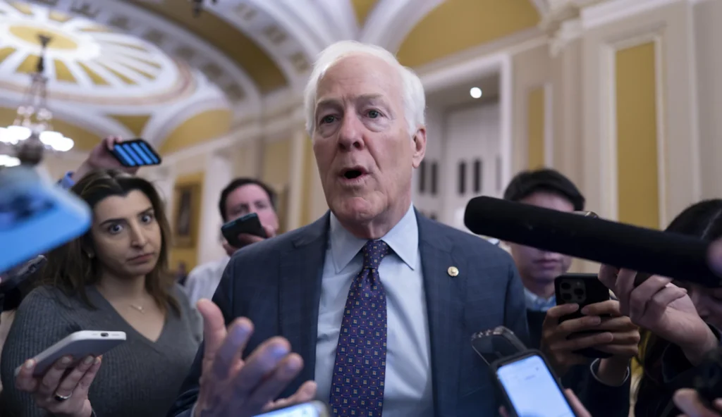 Sen. John Cornyn, R-Texas, is surrounded by reporters as he heads to the chamber during a test vote to begin debate on a border security bill, at the Capitol in Washington, Wednesday, Feb. 7, 2024. (AP Photo/J. Scott Applewhite)