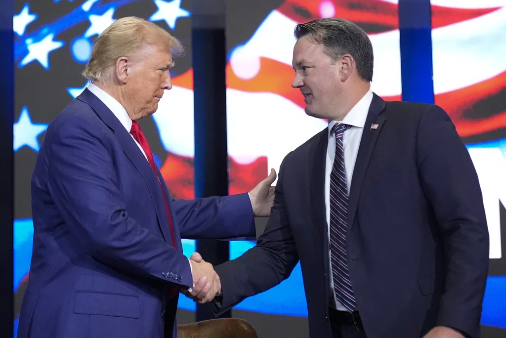 Republican presidential nominee former President Donald Trump arrives for a faith town hall with Georgia Lt. Gov. Burt Jones at Christ Chapel Zebulon, Wednesday, Oct. 23, 2024, in Zebulon, Ga. (