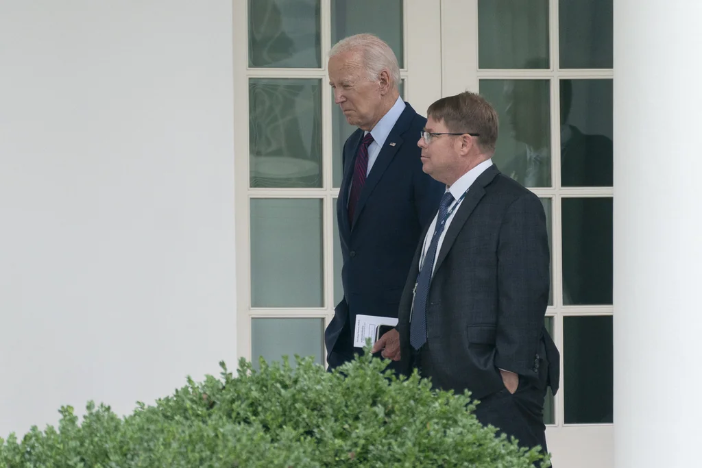 President Joe Biden walks along the Colonnade at the White House with his physician Kevin O'Connor, Monday, Aug. 28, 2023. (AP Photo/Manuel Balce Ceneta)