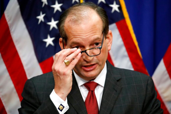In this July 10, 2019, file photo, Labor Secretary Alex Acosta speaks during a news conference at the Department of Labor in Washington. A Justice Department report has found former Labor Secretary Alex Acosta exercised “poor judgment” in handling an investigation into wealthy financier Jeffrey Epstein when he was a top federal prosecutor in Florida.