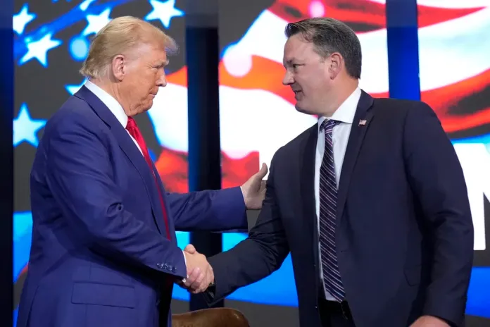 Then-Republican presidential nominee former President Donald Trump arrives for a faith town hall with Georgia Lt. Gov. Burt Jones at Christ Chapel Zebulon, Oct. 23, 2024, in Zebulon, Ga.