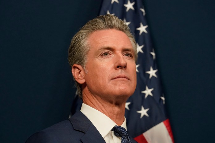 California Gov. Gavin Newsom (D) at a press conference.