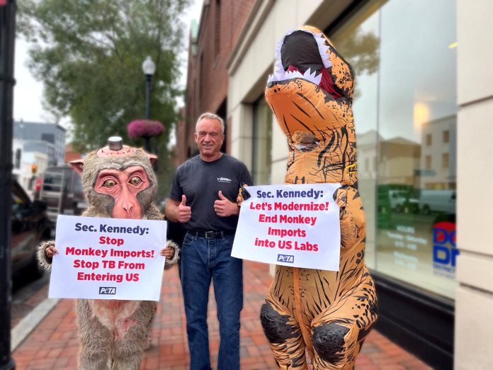 RFK Jr. runs into PETA protesters dressed as a monkey and T. rex.