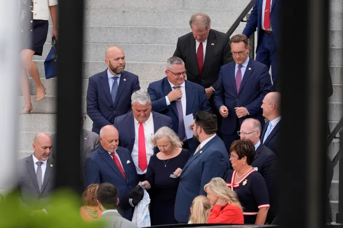 Members of the Indiana state legislature exit the Eisenhower Executive Office Building on the White House complex on Tuesday, Aug. 26, 2025, in Washington.