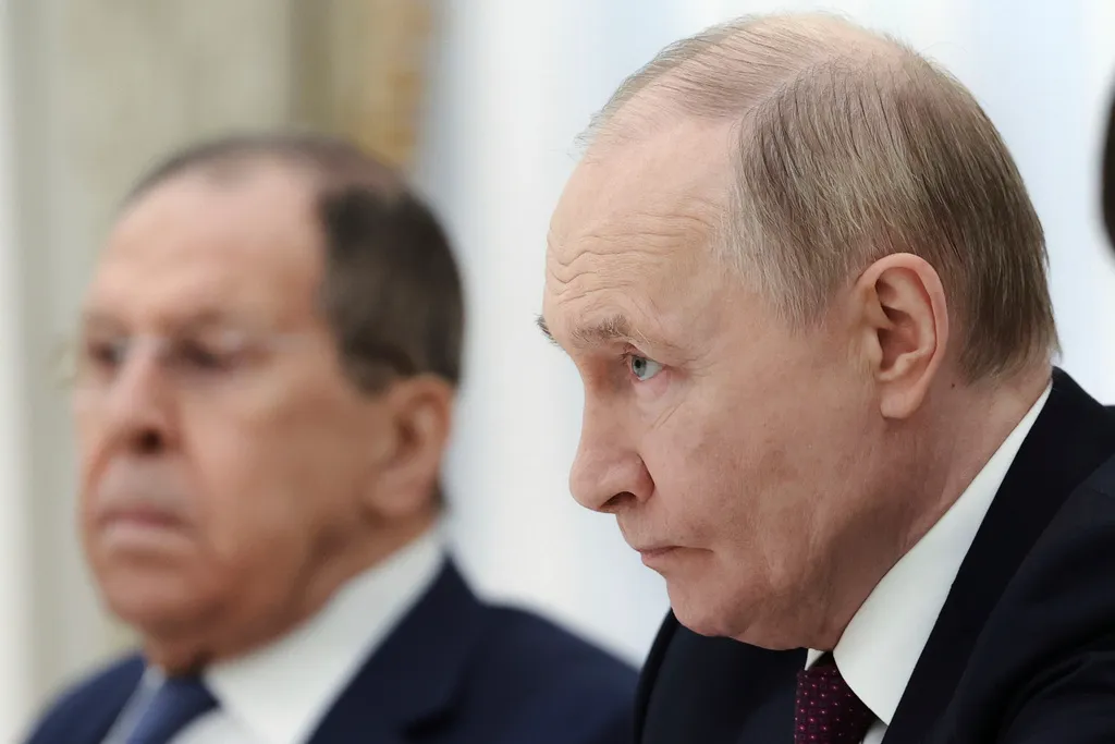 Russian President Vladimir Putin, right, and Russian Foreign Minister Sergey Lavrov listen to Iranian Foreign Minister Abbas Araghchi during their talks at the Kremlin in Moscow, Russia, Monday, June 23, 2025.