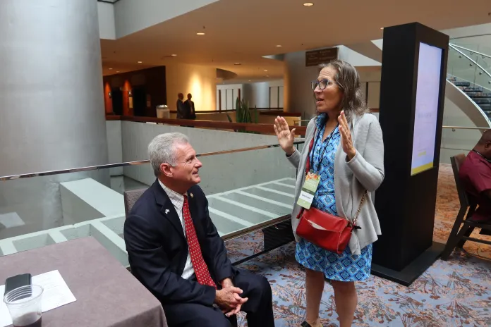 Rep. Buddy Carter (R-GA) speaks with Betsy Kramer at the Republican National Committee's summer meeting in Atlanta on Aug. 22, 2025. (Samantha-Jo Roth, Washington Examiner)