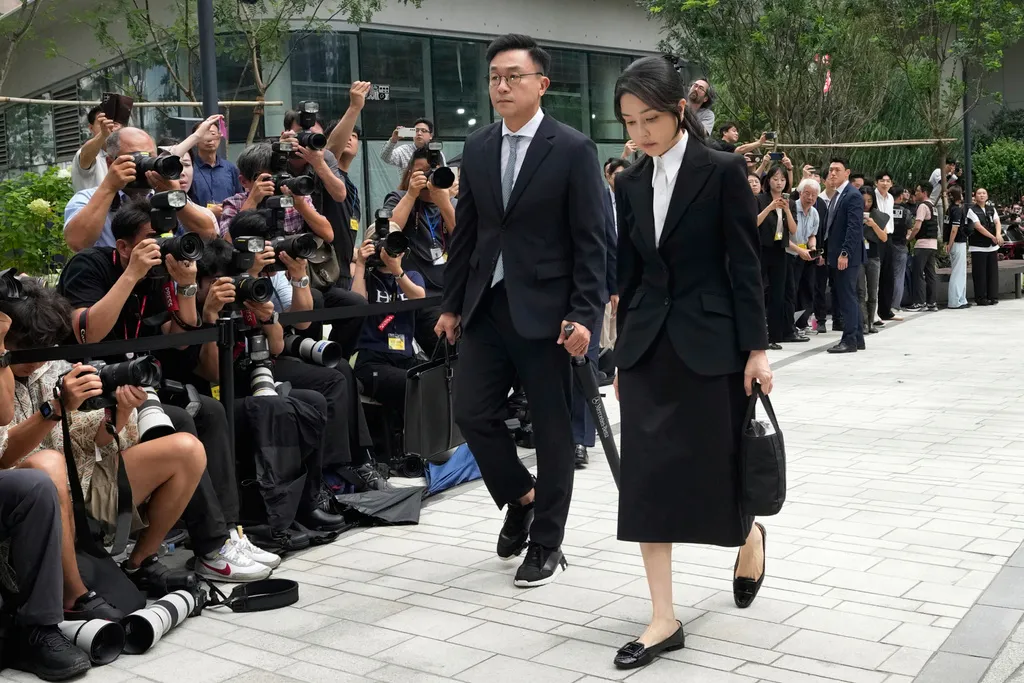 Kim Keon Hee, right, the wife of South Korea's ousted former President Yoon Suk Yeol, arrives at the special prosecutor's office in Seoul, South Korea, on Aug. 6, 2025.