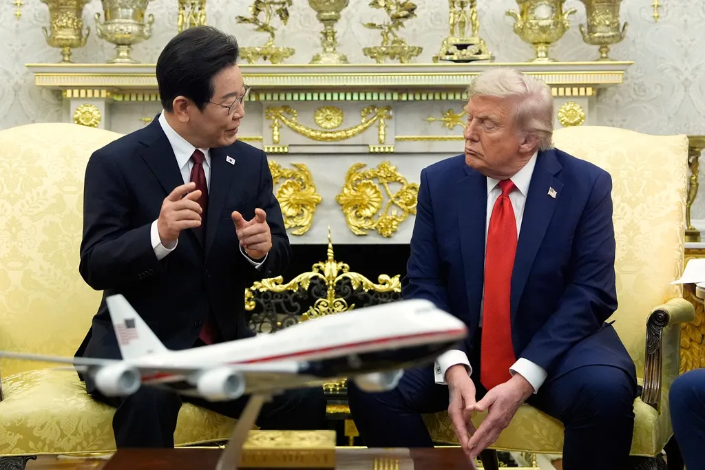 South Korean President Lee Jae Myung speaks as President Donald Trump listens during a meeting in the Oval Office of the White House, Monday, Aug. 25, 2025, in Washington.