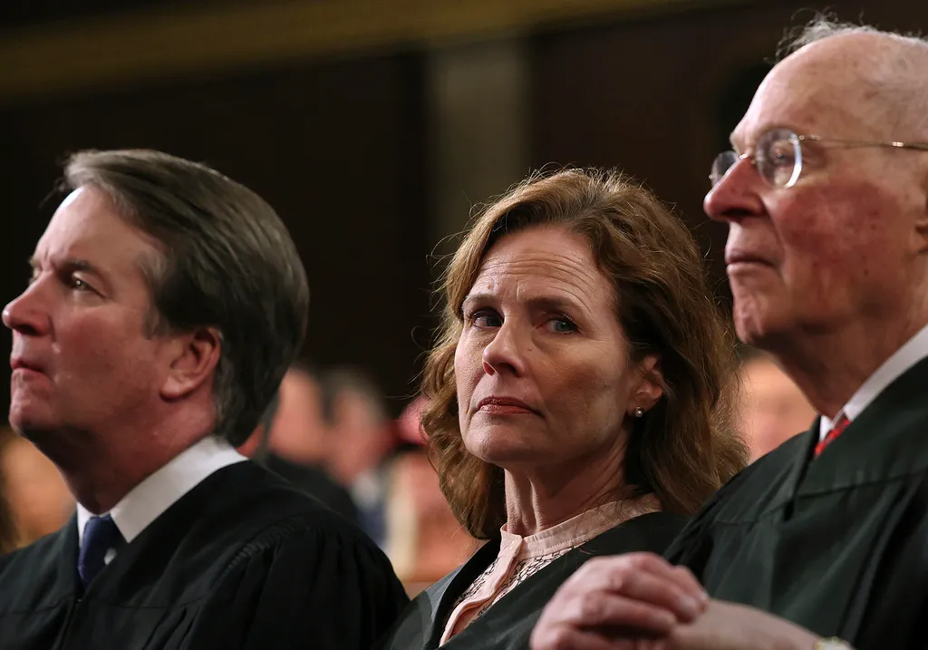 From left, Justice Brett Kavanaugh, Justice Amy Coney Barrett, and retired Justice Anthony Kennedy listen as President Donald Trump addresses a joint session of Congress at the Capitol in Washington, Tuesday, March 4, 2025.