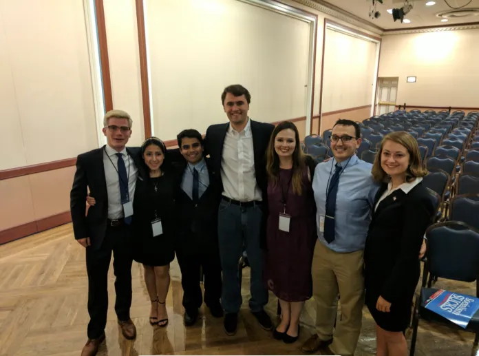 Madeleine Schultz and her Turning Point USA leadership team pose for a photo with Charlie Kirk at the University of Illinois.