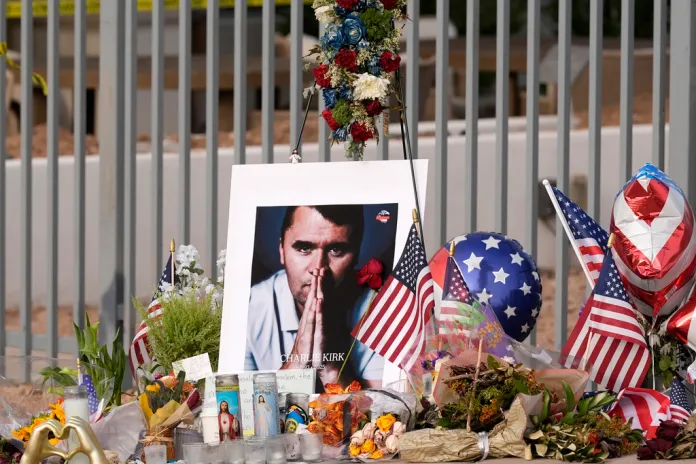 A makeshift memorial grows in size at the Turning Point USA headquarters.