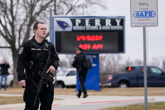 Police respond to Perry High School in Perry, Iowa.
