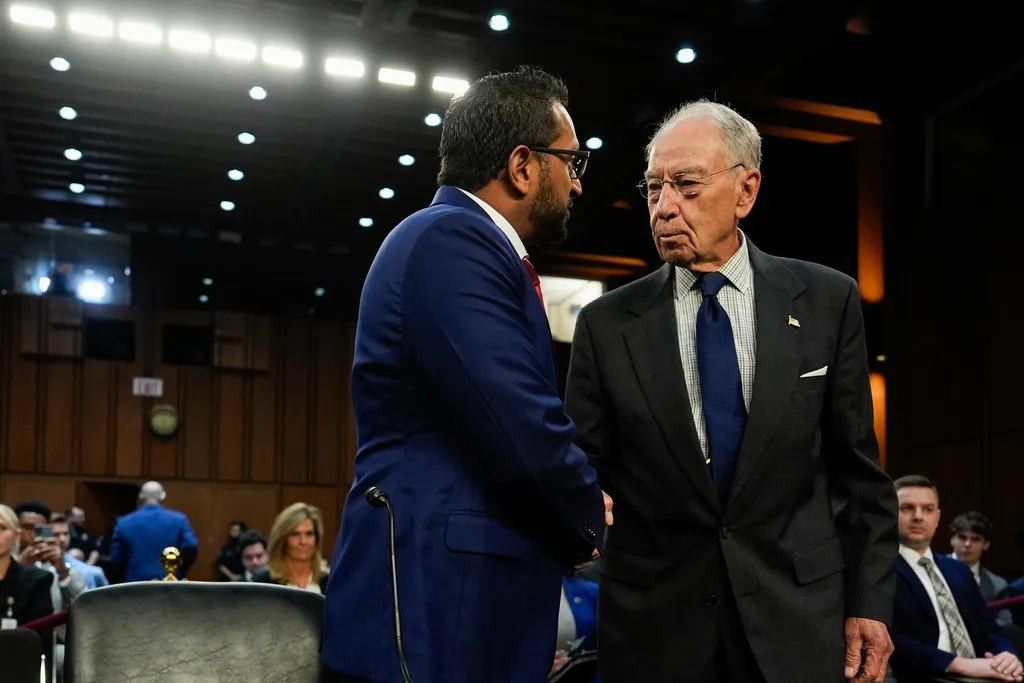 FBI Director Kash Patel, left, shakes hands with Sen. Chuck Grassley, R-Iowa, right, before an appearance before the Senate Judiciary Committee for his first oversight hearing, Tuesday, Sept. 16, 2025, at the Capitol in Washington. 