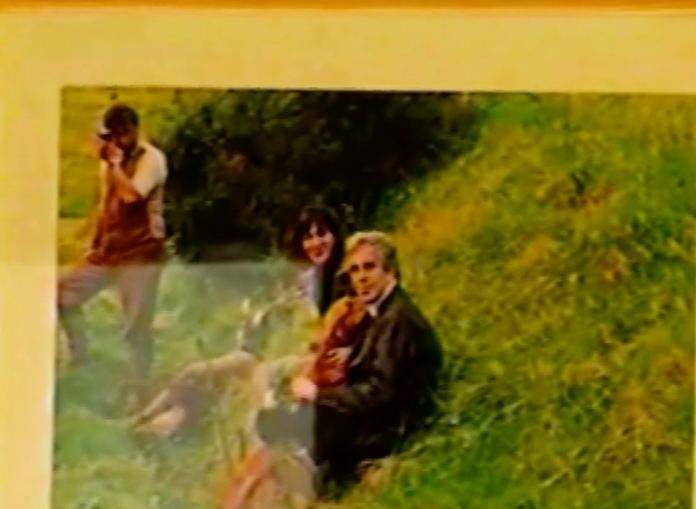 
A photo of Jeffrey Epstein and Ghislaine Maxwell, made publicly available before, is seen in the home raided by law enforcement in one of several tapes attached to the House Oversight Committee's Epstein files release.