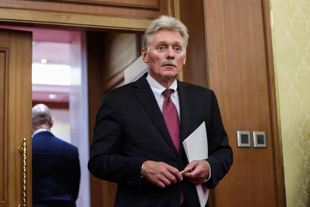 Kremlin spokesman Dmitry Peskov walks at Diaoyutai State Guesthouse in Beijing, China, Tuesday, Sept. 2, 2025. (Maxim Shemetov/Pool Photo via AP)