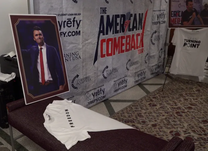 Charlie Kirk picture sits above the last shirt he wore.