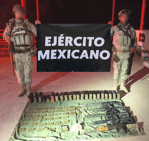 A photo provided by the Mexican Embassy shows firearms and ammunition seized during the country's ongoing crackdown on crime.(Mexico Embassy)