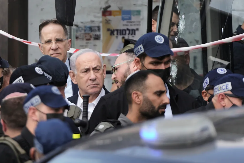 Israeli Prime Minister Benjamin Netanyahu surrounded by Israeli police officers.