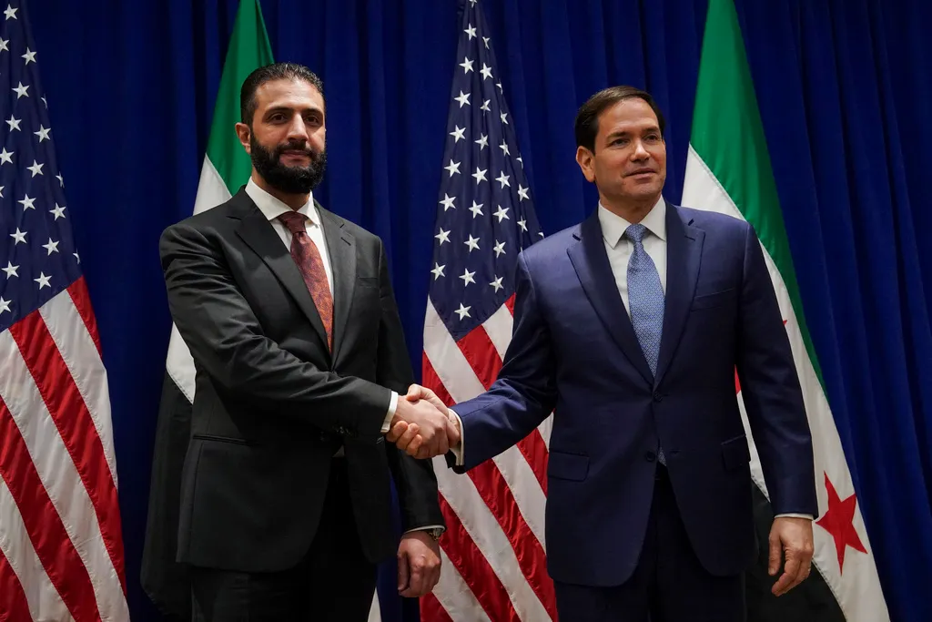 Secretary of State Marco Rubio shakes hands with Syrian interim President Ahmad al Sharaa.