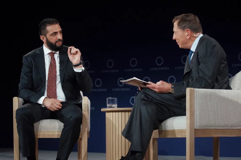 Syrian President Ahmed al Sharaa speaks with former U.S. Army Gen. David Petraeus.