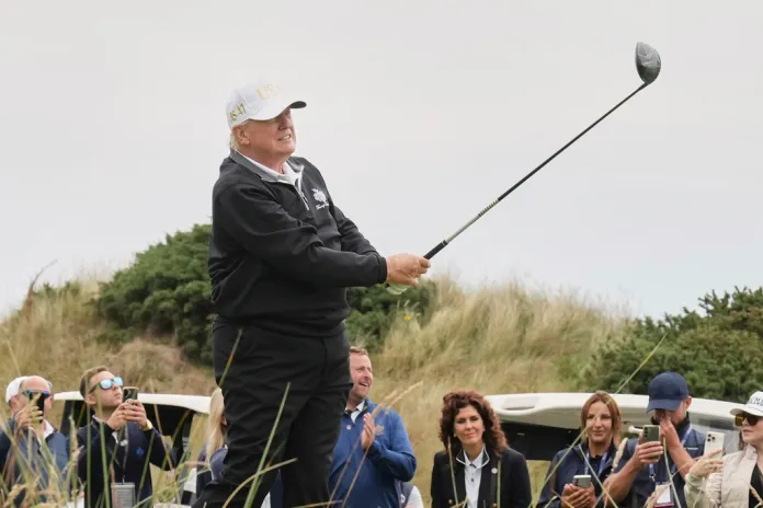 Trump golfing at his golf course in Scotland.
