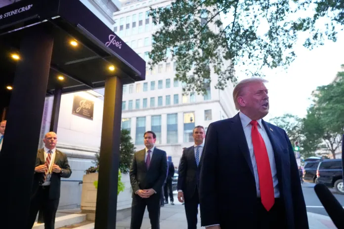 President Donald Trump speaks to reporters before he enters a restaurant near the White House, Tuesday, Sept. 9, 2025, in Washington, to have dinner with Secretary of State Marco Rubio, Defense Secretary Pete Hegseth, and Vice President JD Vance.