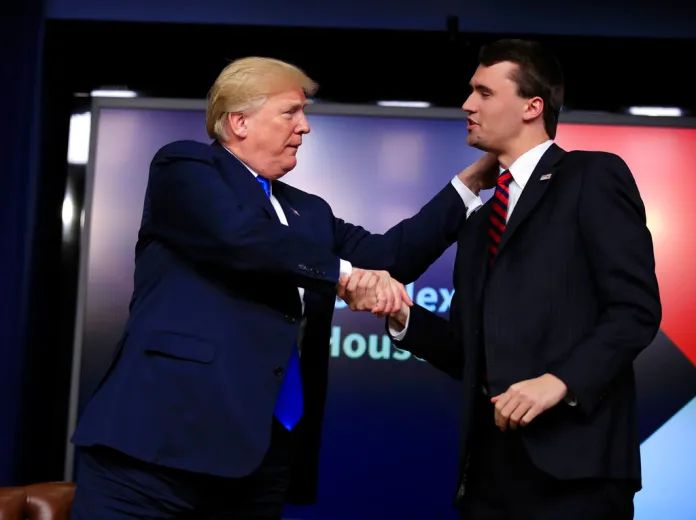 President Donald Trump shakes hands with moderator Charlie Kirk,right, during a Generation Next White House forum at the Eisenhower Executive Office Building on the White House complex in Washington, Thursday, March 22, 2018.